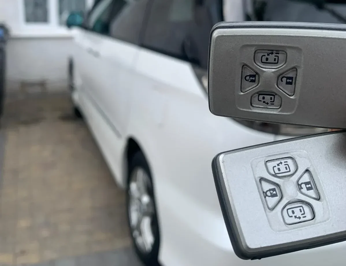 two car keys and a car